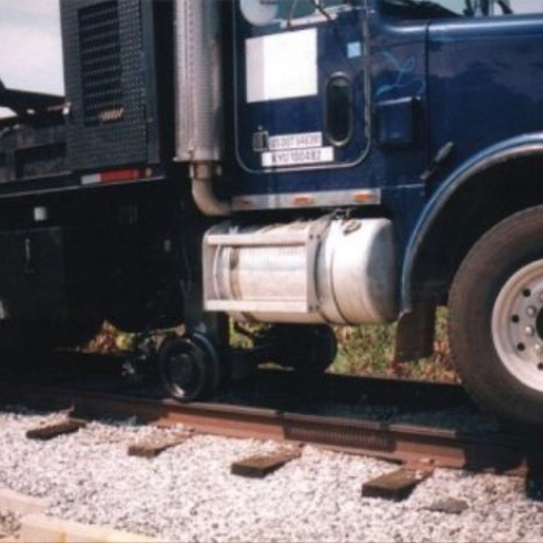 Close up of truck with modified wheels for railroad tracks