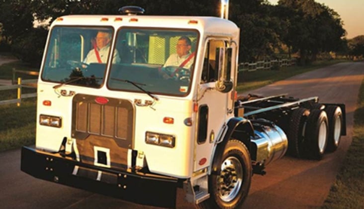 Front view of truck cab with dual steering wheels